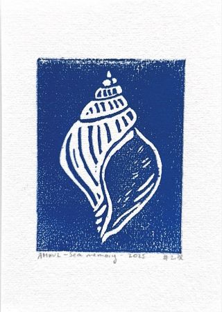 Blue linocut of a sea shell. The sea shell is white and around it is blue like the ocean.