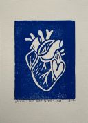 A blue linocut of heart within a heart. The heart is white, and all around is blue.