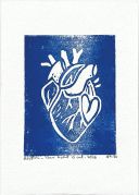 A blue linocut of heart within a heart. The heart is white, and all around is blue.
